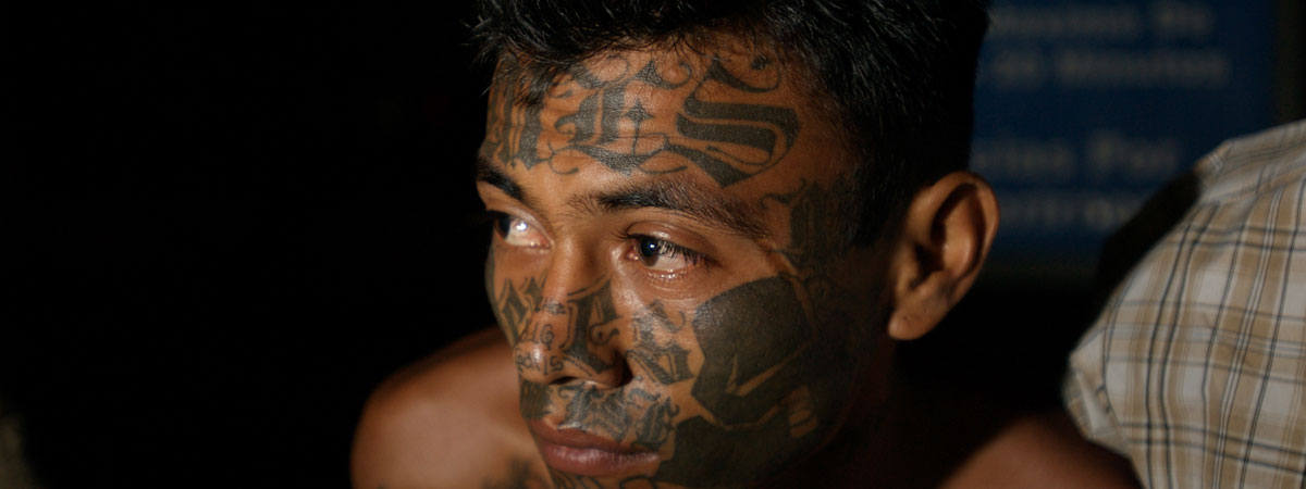 Image of the tatooed face of an MS-13 gang member