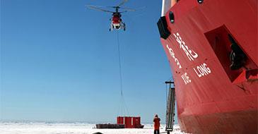 China’s research icebreaker Xuelong, or Snow Dragon, unloads cargo on sea ice near China-built Zhongshan Station in Antarctica, December 28, 2017, beginning country’s 34th Antarctic expedition (Xinhua/Alamy Live News/Bai Guolong)